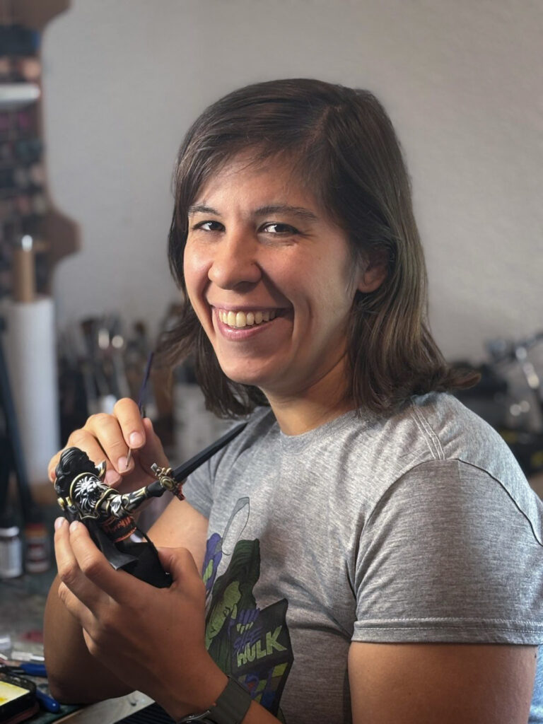 Ruth Meridjen Nat20Crafts co-founder painting D&D miniatures